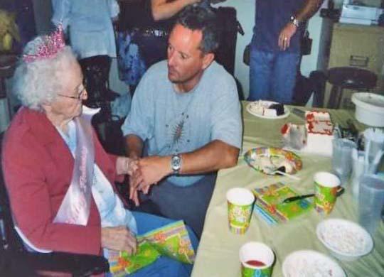 Mary Ann and grandson, John Schmitt Celebrating Mary Ann Kuepper's 99th birthday with grandson, John Robert Schmitt at Beverly Healtcare, Columbus, Nebraska on August 12, 2006.